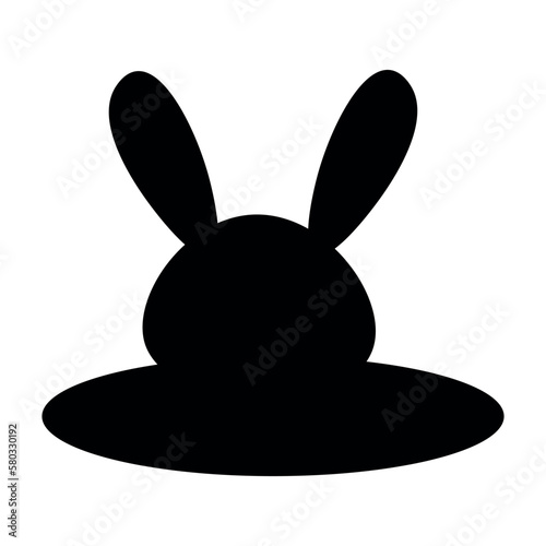 Silhouette of a rabbit in a hole