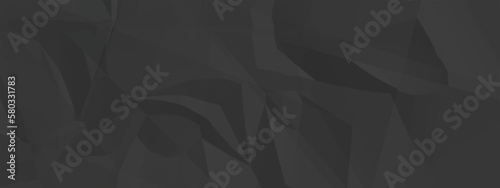 Black creased crumpled paper texture background. Black paper sheet texture.
