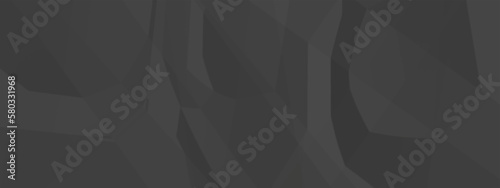 Black creased crumpled paper texture background. Black paper sheet texture.
