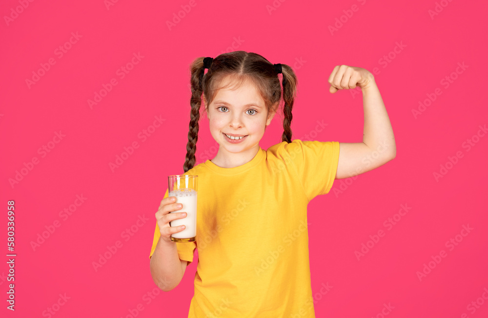 Cute Little Gild Holding Glass Of Milk And Showing Biceps Cute Little Gild Holding Glass Of Milk And Showing Biceps