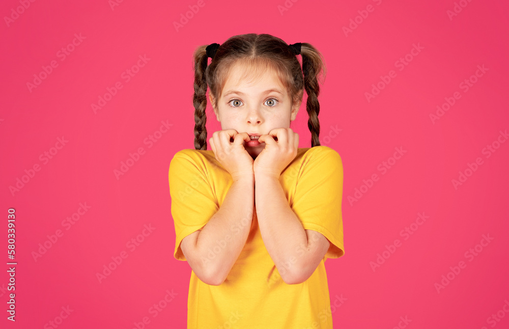 Oops. Portrait Of Shocked Little Girl Touching Face And Looking At Camera Oops. Portrait Of Shocked Little Girl Touching Face And Looking At Camera