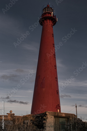 red lighthouse on the coast