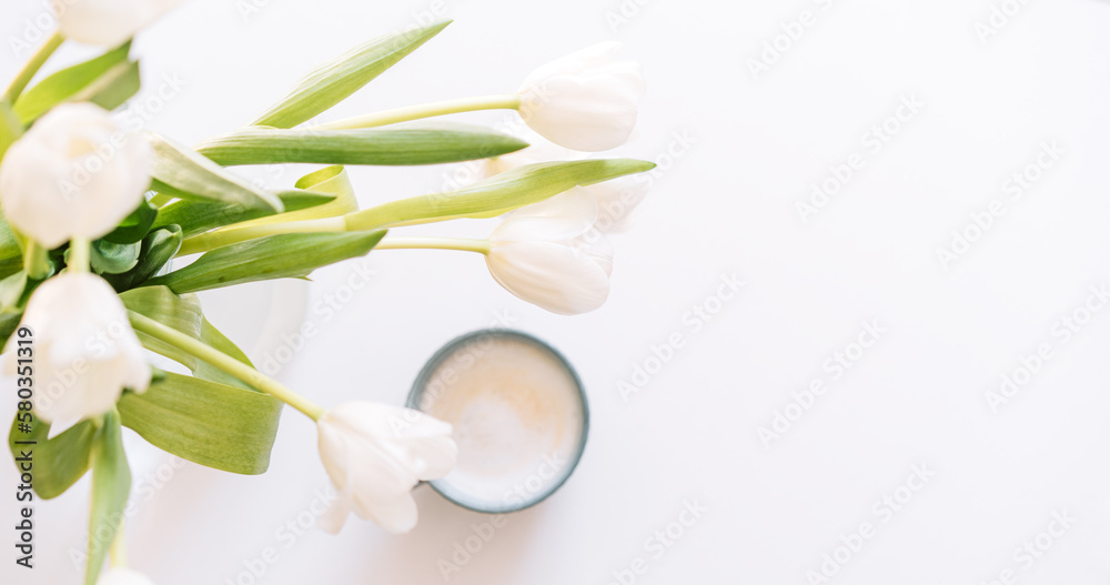 Bouquet of white tulips with cup of coffee on white background. Bouquet of white tulips with cup of coffee on white background.