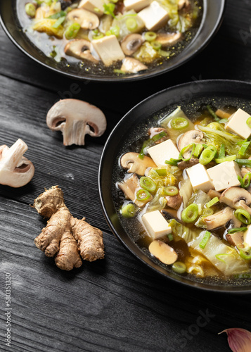 Cabbage Tofu Soup with mushrooms and spring onion.