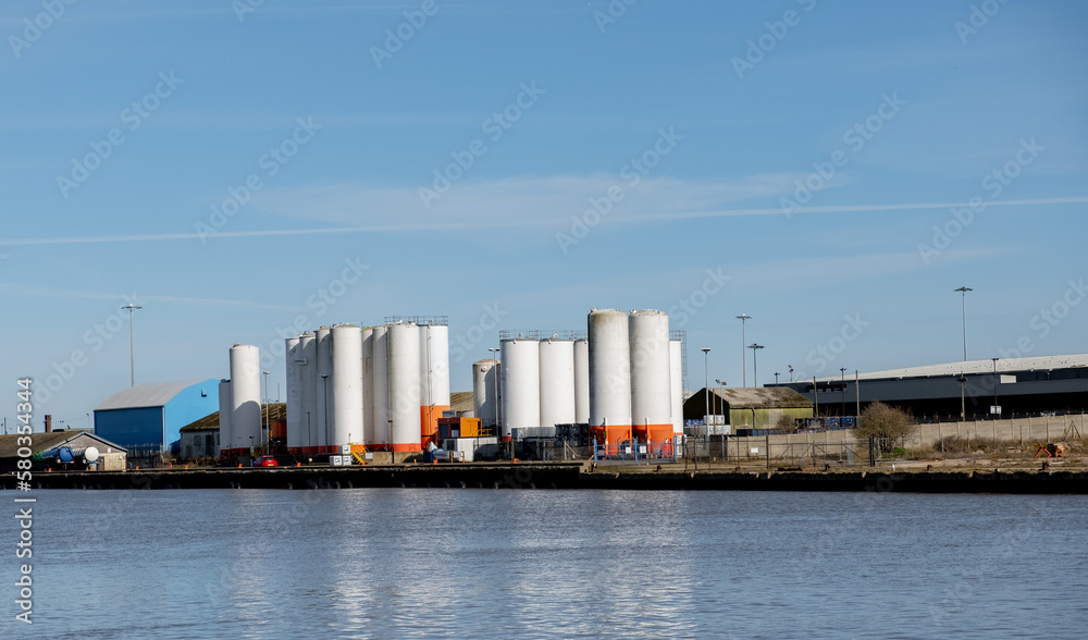 Industrial units on the side of the River Yare docks in the seaside town of Great Yarmouth on a sunny day