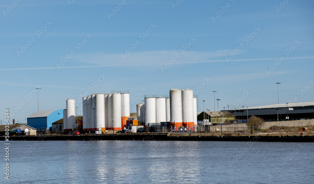 Industrial units on the side of the River Yare docks in the seaside town of Great Yarmouth on a sunny day Industrial units on the side of the River Yare docks in the seaside town of Great Yarmouth on a sunny day