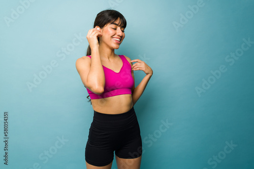 Fitness woman listening to music during her workout