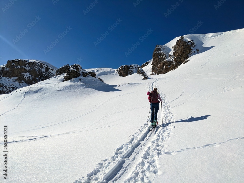 Beautiful ski touring slope in a fantastic mountain world. Ski mountaineering in the swiss alps. Wonderful Skitour. High quality photo