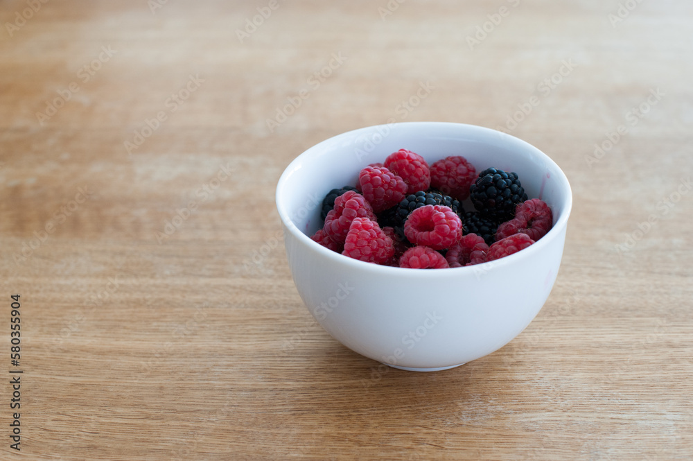 Raspberries and blackberries in a bowl Raspberries and blackberries in a bowl