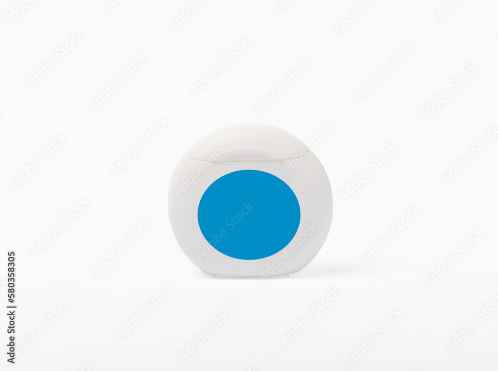 Dental floss isolated on white background.Container with dental floss. dental care. Fresh breath. Prevention of caries. Dentistry concept. Dental floss isolated on white background.Container with dental floss. dental care. Fresh breath. Prevention of caries. Dentistry concept.