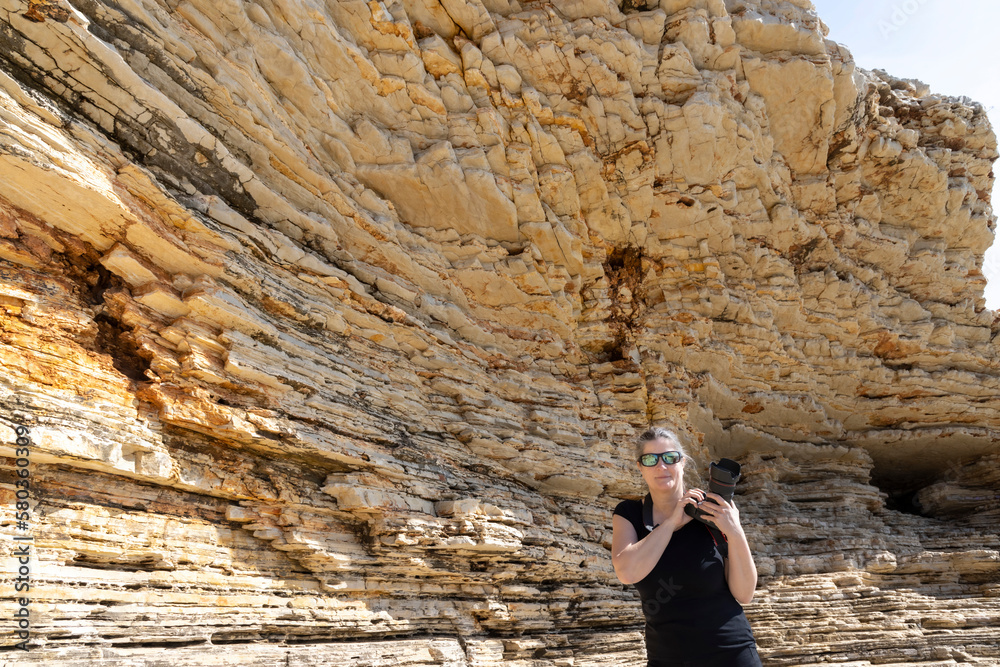 woman on the rocks of Cape Kamenjak, a protected natural area on the southern tip of the Istrian peninsula in Croatia, Europe
