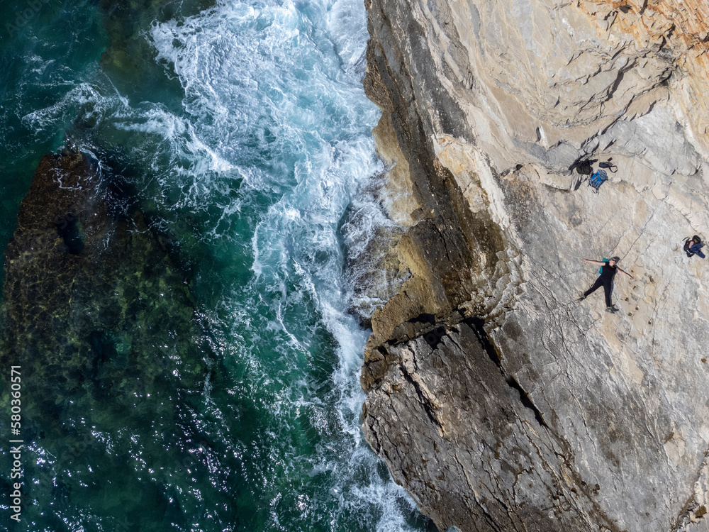 Φωτογραφία woman lying on the rocks of Cape Kamenjak, a protected natural area on the south