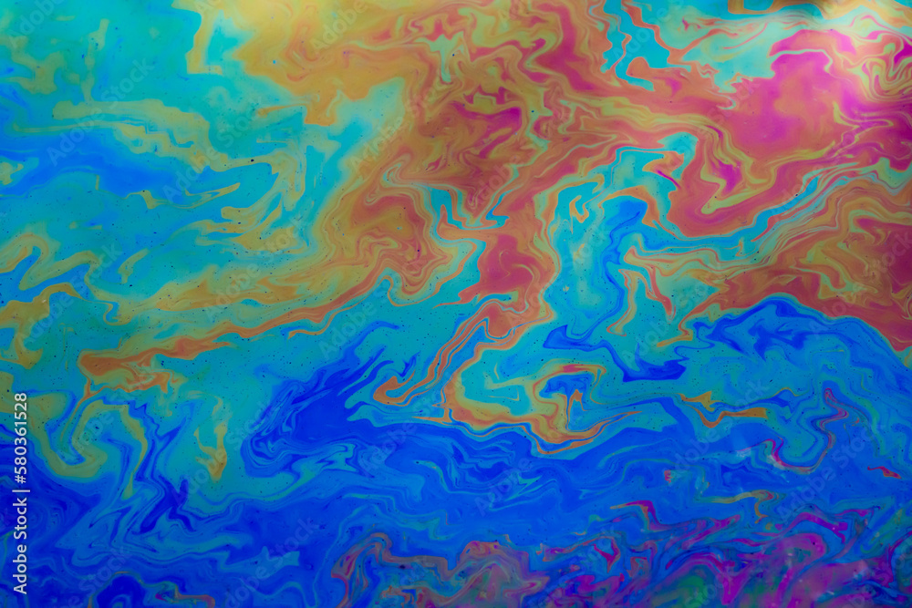 colored stains of gasoline oil on the water, iridescence colored stains of gasoline oil on the water, iridescence