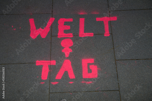 Graffiti in german on a sidewalk on occasion of international women's day. photo