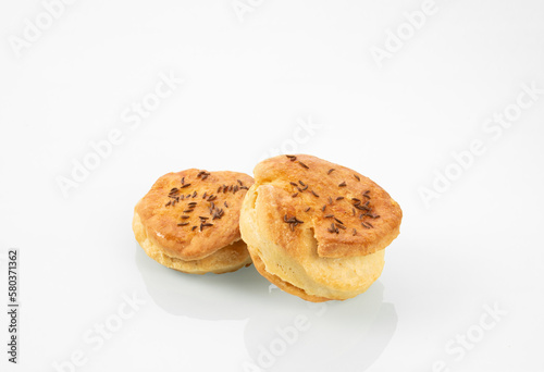 National Hungarian cuisine.Two buns with caraway seeds on a white mirror background