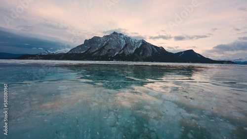Abraham Lake with natural bubbles frost in the morning on winter at Banff national park