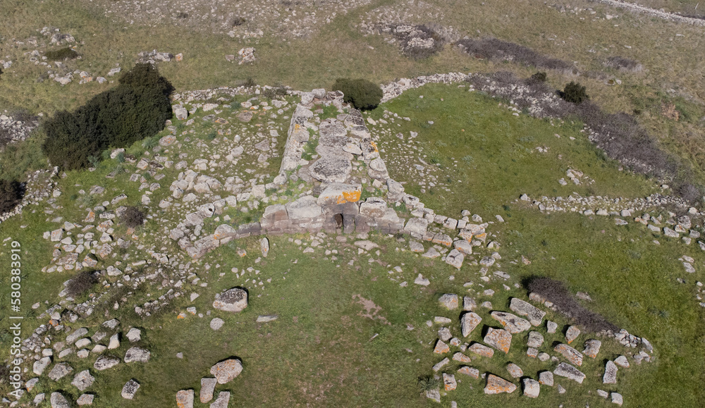 Archeological ruins of Nuragic necropolis Giants Tomb of S’omu de S’orcu - Tomba di Giganti Omu de Orcu - with front grave stones of Neolithic cemetery
Archeological ruins of Nuragic necropolis Giants Tomb of S’omu de S’orcu - Tomba di Giganti Omu de Orcu - with front grave stones of Neolithic cemetery
