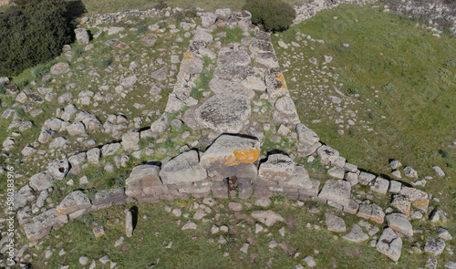 Archeological ruins of Nuragic necropolis Giants Tomb of S’omu de S’orcu - Tomba di Giganti Omu de Orcu - with front grave stones of Neolithic cemetery
 photo