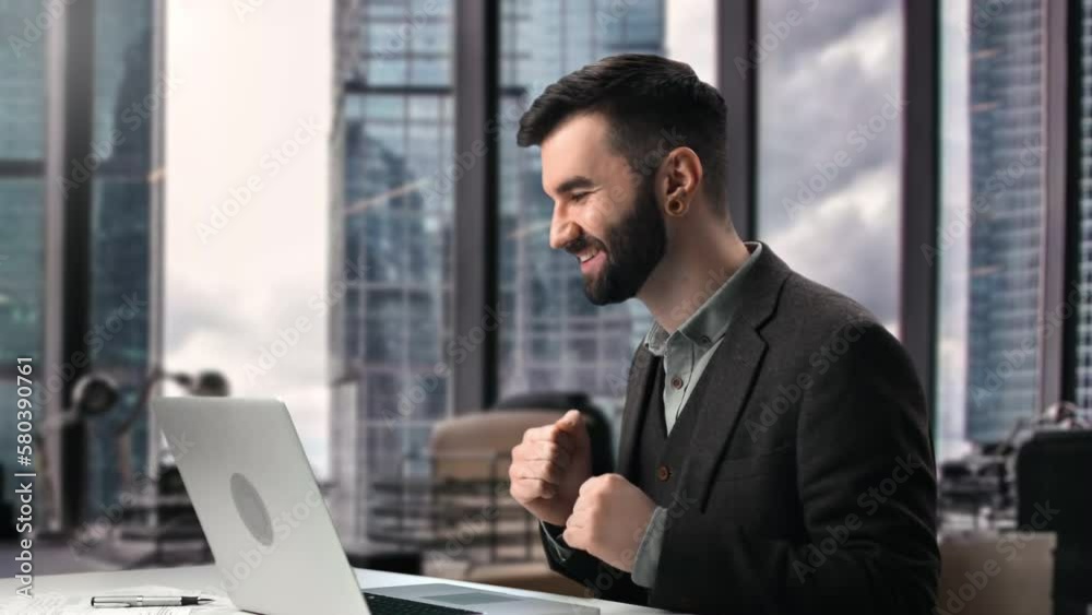 Overjoyed business man boss received good news laptop email success deal downtown skyscraper office Overjoyed business man boss received good news laptop email success deal downtown skyscraper office
