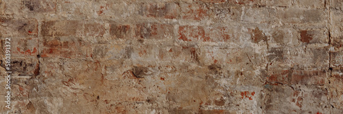 Background or background of an old vintage dirty brick wall with peeling plaster. Texture of cracked red bricks. Banner for website header design with copy space.