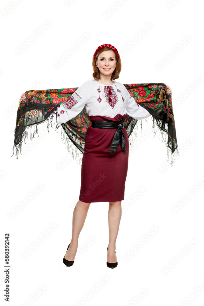 Beautiful adult Ukrainian women in national costume. Attractive Ukrainian woman wearing in traditional Ukrainian embroidery, isolated at white background.