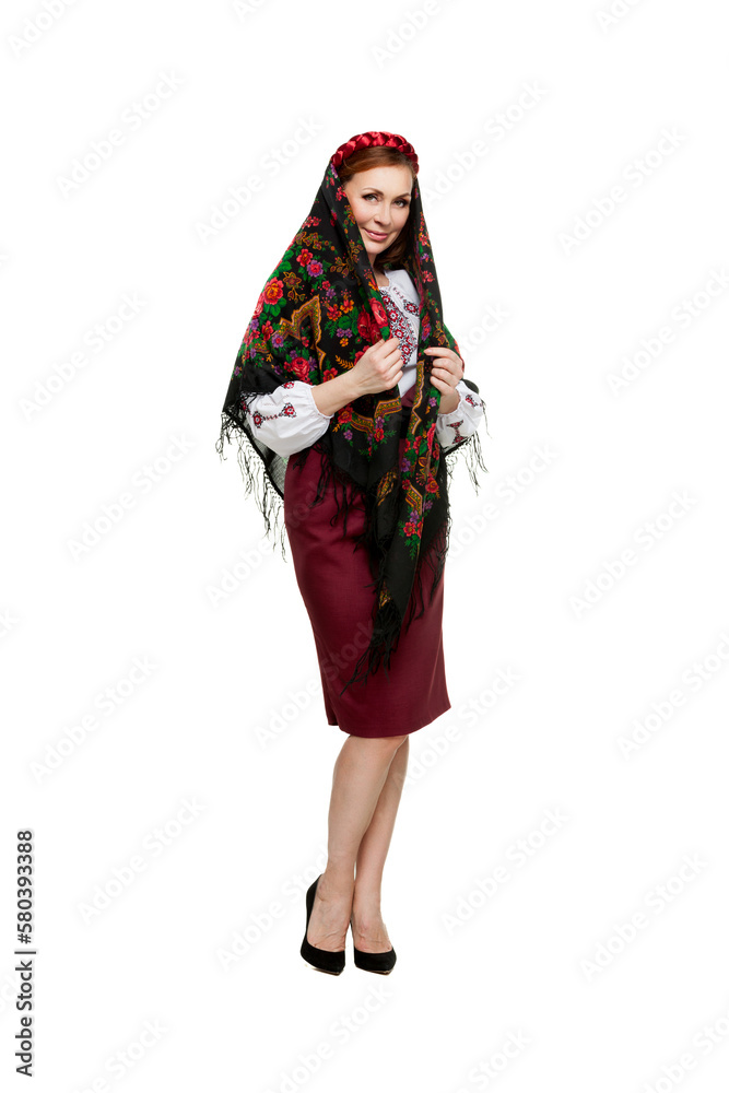 Beautiful adult Ukrainian women in national costume. Attractive Ukrainian woman wearing in traditional Ukrainian embroidery, isolated at white background.