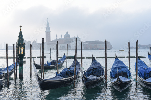 Venice, Italy - 15 Nov,  2022: Morning views of gondolas, the Grand Canal, and San Giorgio Bell Tower © Mark