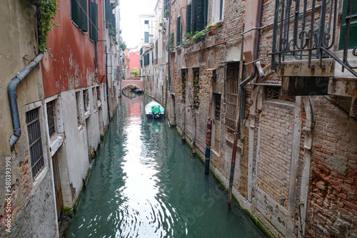 Venice, Italy - 14 Nov, 2022: Colourful backstreet canals of the Venetian Lagoon © Mark