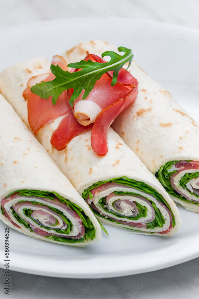 wraps filled with letuce and schwarzwald ham