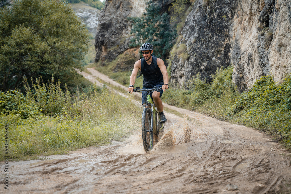 caucasian man riding electric bikes e-bike bicycles at the gorge