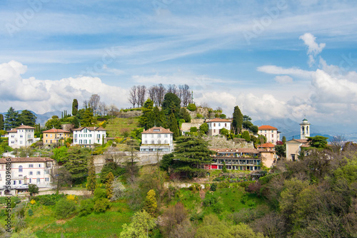 Scenic aerial view of Bergamo city. Flying over Citta Alta, town's upper district, known by cobblestone streets and encircled by Venetian walls. Bergamo, Lombardy, Italy.