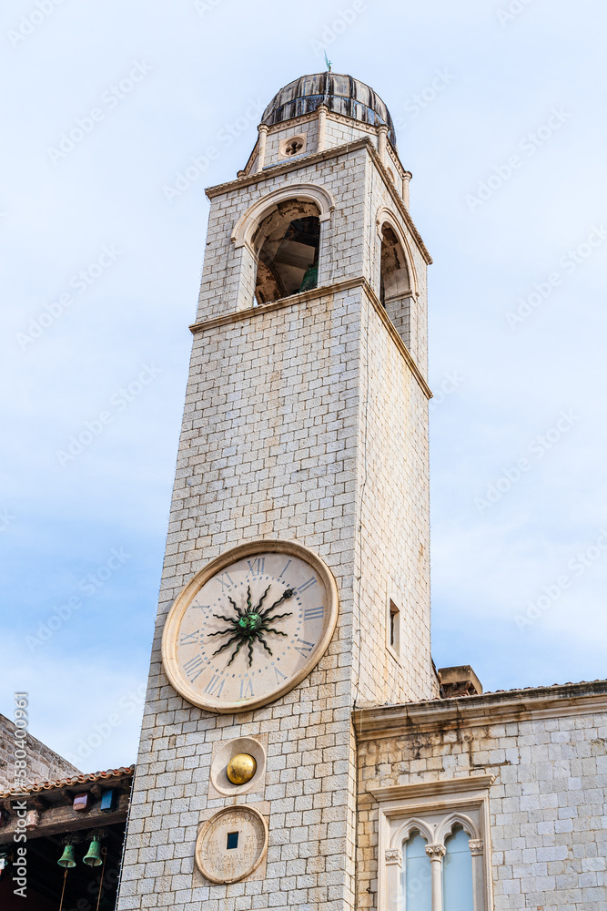 Dubrovnik, Croatia: Dubrovnik Bell Tower, medieval clock tower in Luza Square at the end of the Stradun in the old town - obrazy, fototapety, plakaty 