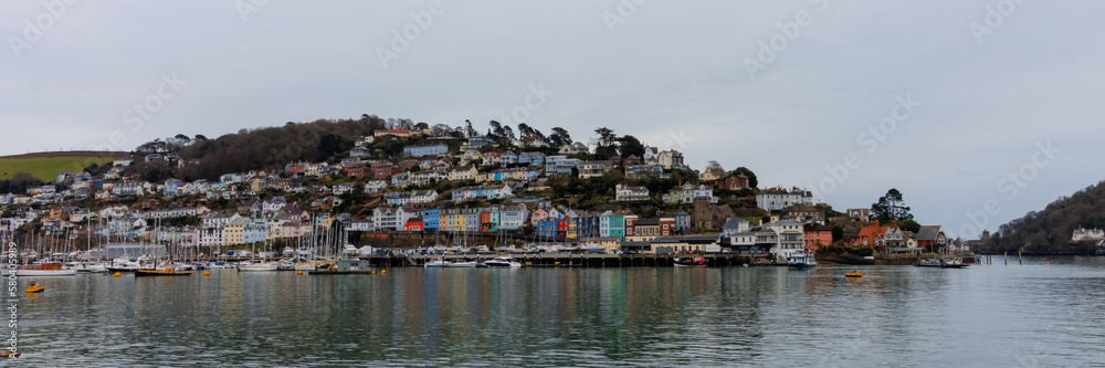 Kingswear - coastal town in Devon with vibrant and colourful buildings. View from Dartmouth side of the river 