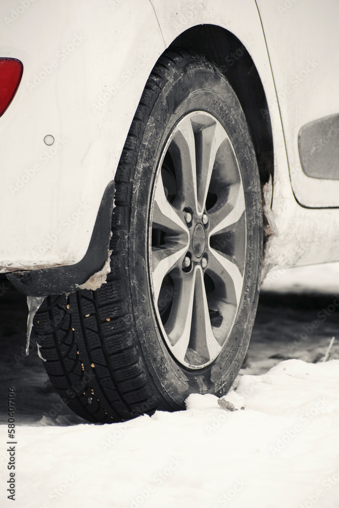 vehicle with snowy ground and snow tires