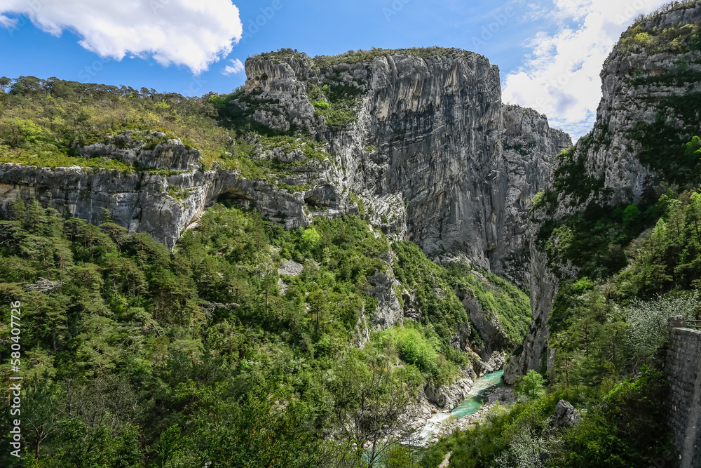 Big mountains of large Verdon canyon and small mountain river in the bank of valley