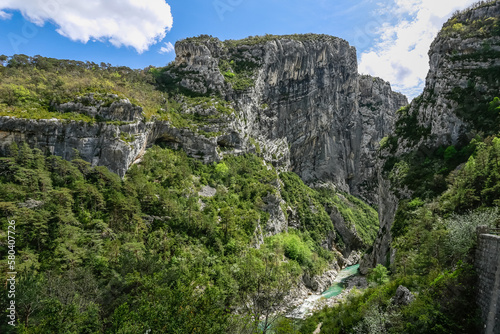 Big mountains of large Verdon canyon and small mountain river in the bank of valley