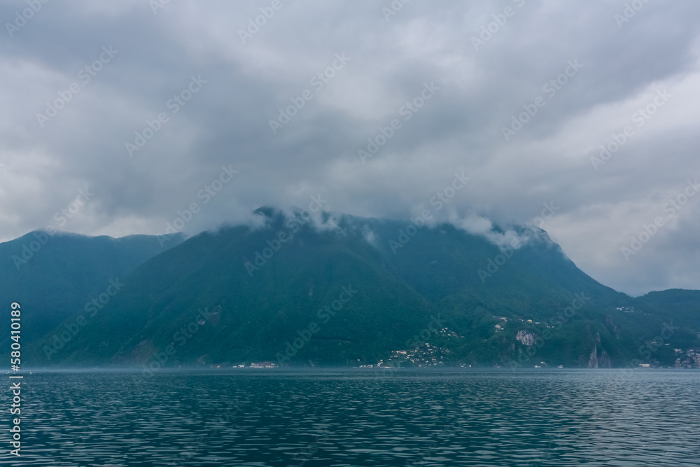 Big mountains in grey clouds in Italy, lake Garda