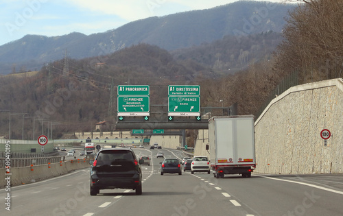 junction of the Italy Autostrada with localities near Florence and motor vehicles photo