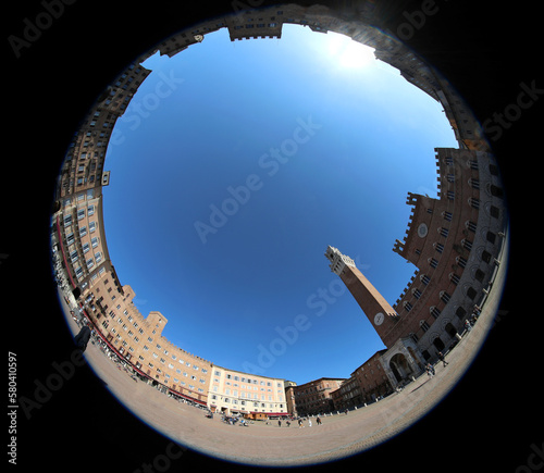 fisheye lens view of the Tower called TORRE DEL MANGIA in the main Piazza of SIENA in Italy photo