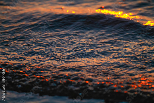 Abstract waves in sunset. Beautiful water wave texture in sunset colours