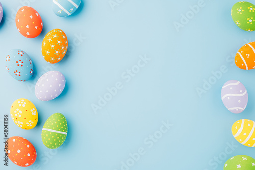 Colorful easter eggs isolated on blue background with copy space, Funny decoration, Creative composition banner web design holiday background, Happy Easter Day greeting card, flat lay top view