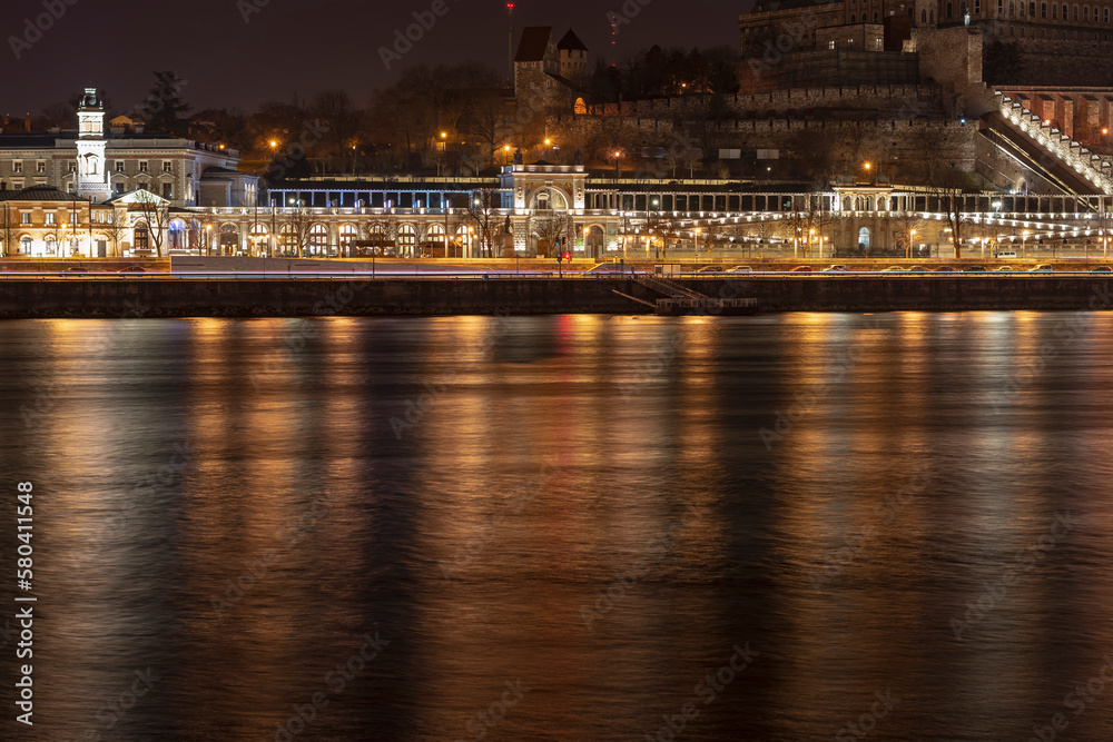 Illuminated Varkert Bazar (is the lower part of the Buda Castle) at night with the Danube river, Budapest, Hungary
