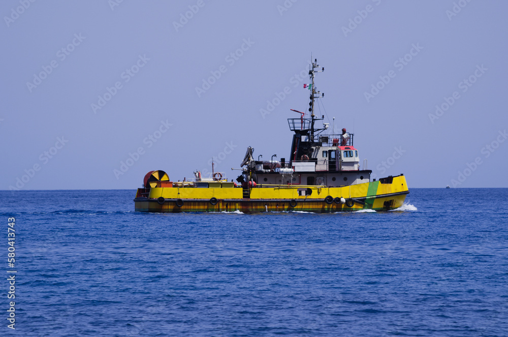 Naval unit of the Italian "yellow fleet" (maritime anti-pollution service). It fights marine pollution, collect floating marine litter and, in an emergency, by containment and recovery of hydrocarbons - obrazy, fototapety, plakaty 