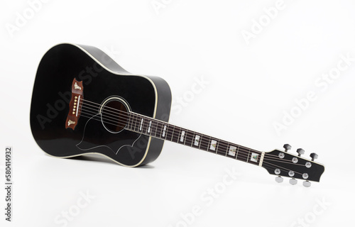 Musical instrument - vintage black acoustic guitar white background