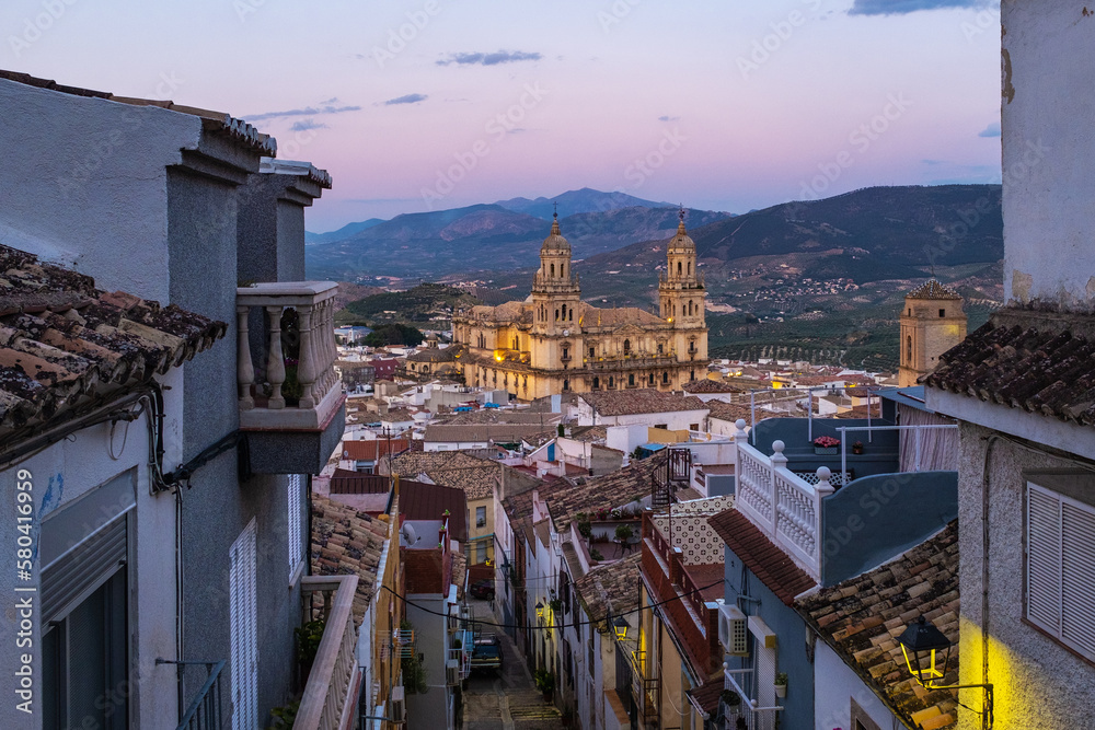 Cityscape of the Andalusian city of Jaen at dusk, with the cathedral to be recognized among the rooftops. - obrazy, fototapety, plakaty 