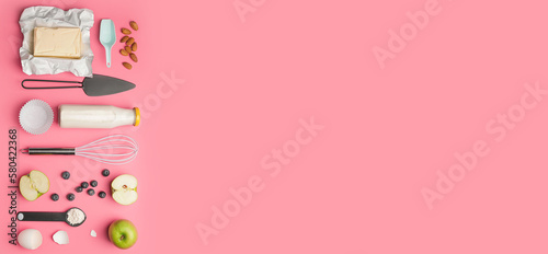 Ingredients for preparing bakery and utensils on pink background with space for text © Pixel-Shot