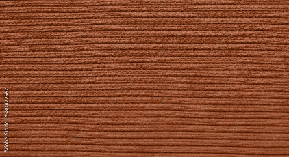 Texture of brown knitted fabric as background Texture of brown knitted fabric as background