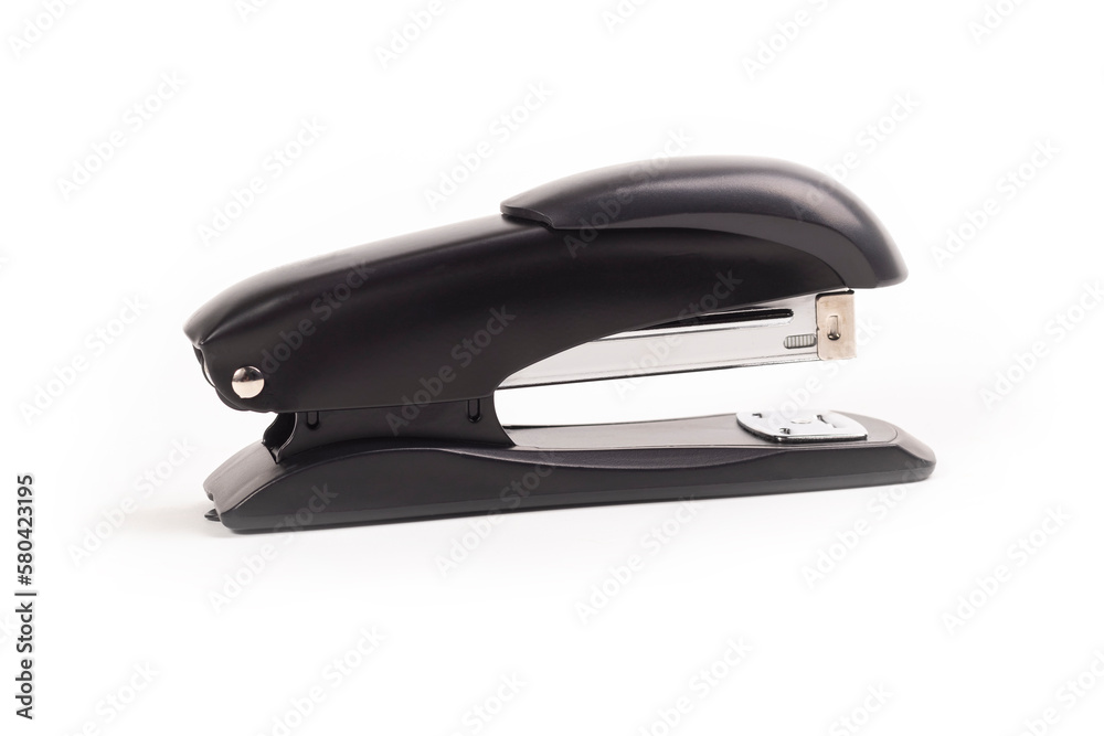a dark metal stapler. close-up. on a white background. a dark metal stapler. close-up. on a white background.