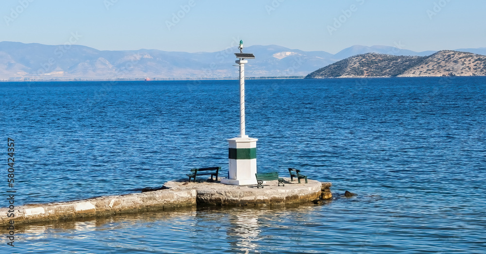Lighthouse on Limenas Port of Thasos or Thassos Greek island in the North Aegean Sea.