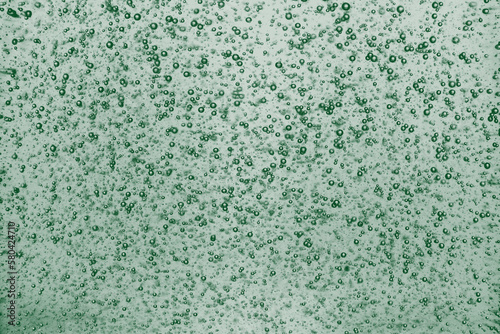 Bubble green emerald texture background little shampoo bubbles.